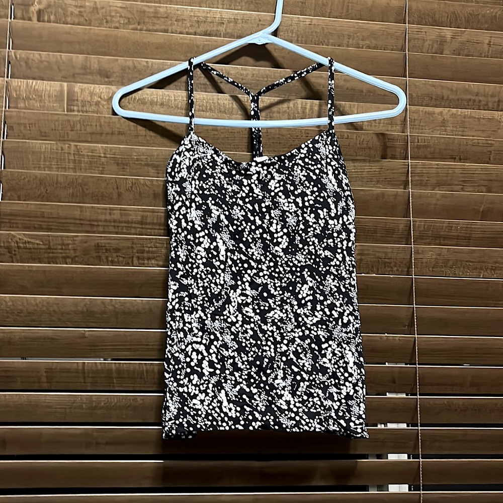 Lululemon tank top with black under bra, with white spots as the design
